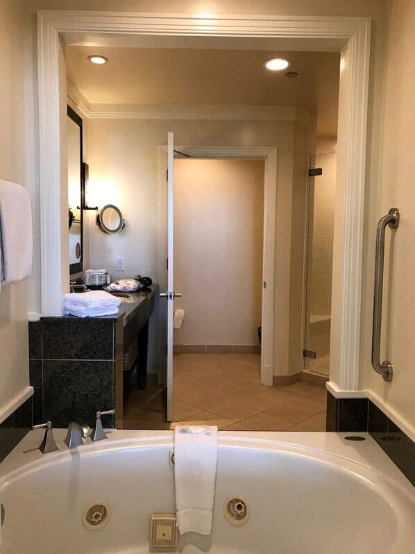 A modern bathroom with a large bathtub, a vanity with a mirror, and a shower area. - Xmas Wk 12-21 to 12-28-25 Westin Kaanapali Ocean Villa 2 br, Oceanview, Deluxe (Lahaina)