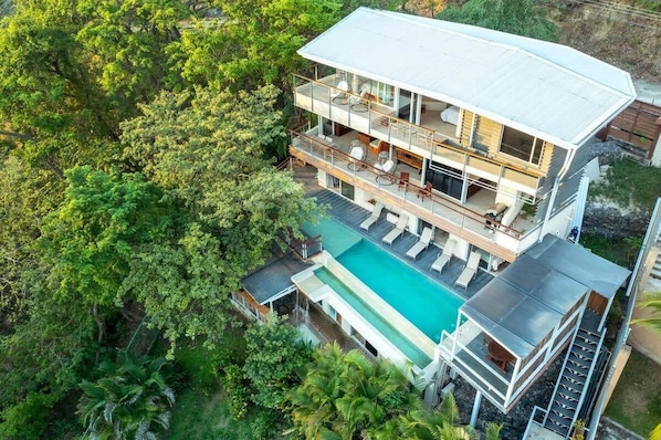 Our 4 Story waterfall House is surrounded by the Jungle! Enjoy nature from our infinity pool!