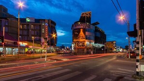 A building with a prominent casino sign and a large, illuminated structure. - Spanhoek Boutique Hotel (Paramaribo)