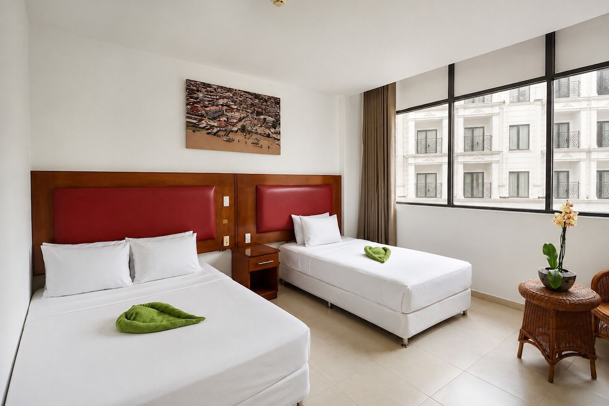 Deluxe Triple Room | In-room safe, desk, laptop workspace, blackout curtains