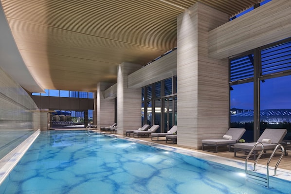Indoor pool, seasonal outdoor pool, pool umbrellas, sun loungers
