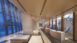 A modern hotel lobby with a reception desk, seating areas, and large windows offering views of the outside. - Hyatt Regency Hengqin (Zhuhai)
