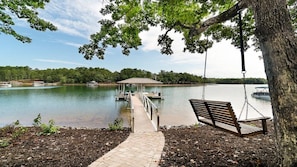 A dock extending into a lake with a swing chair and a bench under a tree. - Stay awhile and RELAX at Lake Keowee, Clemson and the mountains!
The 5 Seasons (West Union)