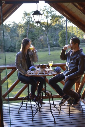 Honeymoon Chalet | Living area | 32-inch LED TV with digital channels, TV, fireplace