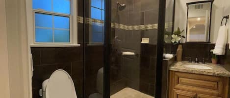Shower, hair dryer, towels, soap