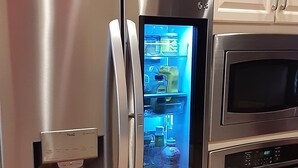 A stainless steel refrigerator with a built-in ice maker and a digital display. - 3,200SF Home/ 3.5 Bathrooms-3 Showers/Wrap Around Porch/Walk to Town/Beach (Harbor Springs)