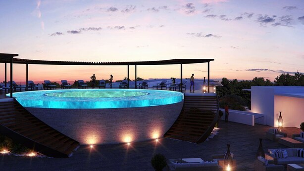 Un espace piscine aménagé sur le toit, comprenant un jacuzzi, des chaises longues et un coin salon abrité.