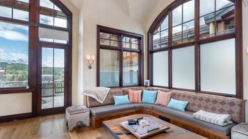 Condo, Multiple Beds (TELEMARK TOWER) | Living room | Flat-screen TV, fireplace, offices