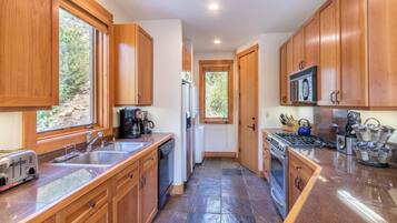 Condo, 2 Bedrooms | Private kitchen | Fridge, microwave, stovetop, dishwasher