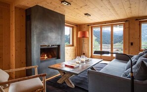 Villa, Multiple Beds (Chalet Isabel) | Living room | Flat-screen TV, fireplace