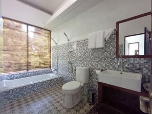 Deluxe Double Room | Bathroom | Separate tub and shower, rainfall showerhead, hair dryer, slippers