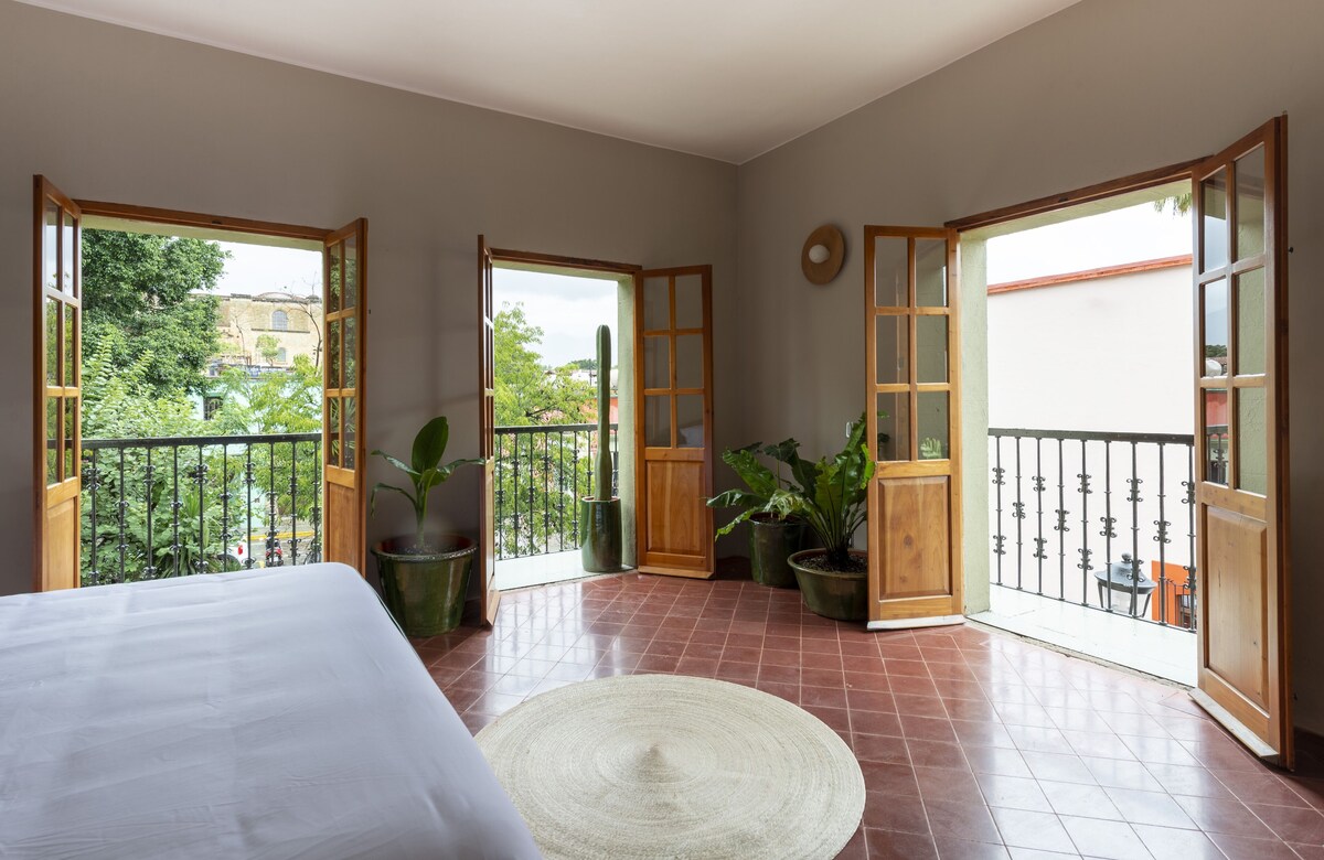 clean hotel room with all the doors open at one of the Best Places to Stay in Oaxaca City
