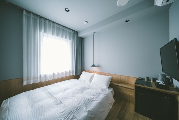 غرفة مزدوجة (Compact) | تجهيزات عازلة للصوت وواي فاي مجانًا وملاءات أسرّة