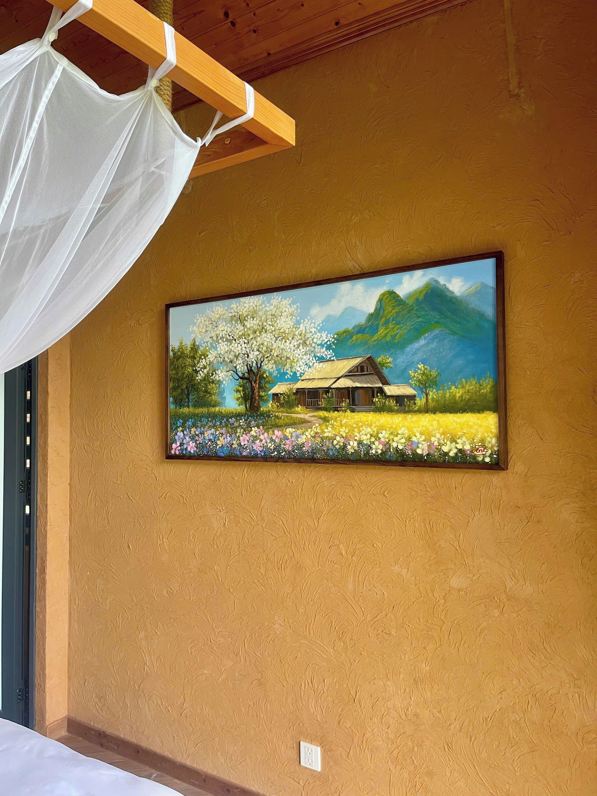 A painting of a house with a tree and flowers on a textured wall.