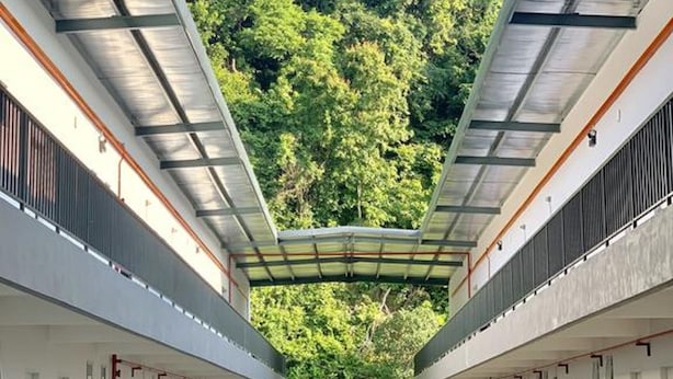 A covered outdoor area with a view of a forested hillside. - The Sassy House (Langkawi)
