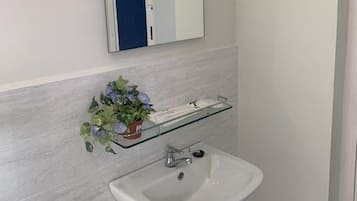 Shower, towels, soap, shampoo