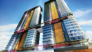 Um edifício moderno e imponente, com vários andares, janelas amplas e uma estrutura central marcante.