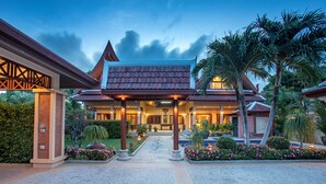 A traditional building with a tiled roof, a central courtyard, and a pool. - Blissful Villa Felicity with Ample Space (Rawai)