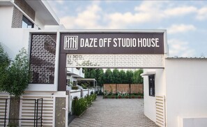 The entrance to a modern building with a sign reading "DAZE OFF STUDIO HOUSE". - Daze Off Studio House (Bhuj)