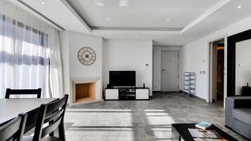 Apartment, 2 Bedrooms, Pool Access | Living room | 42-cm flat-screen TV with satellite channels, TV, fireplace