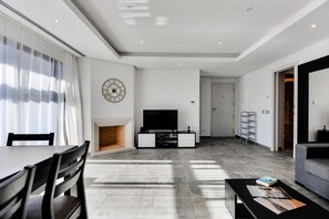 Apartment, 2 Bedrooms, Pool Access | Living room | 42-cm flat-screen TV with satellite channels, TV, fireplace - Falesia Beach B (Albufeira)