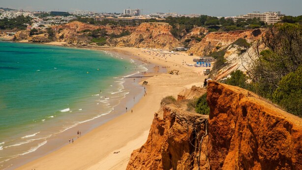 A coastal beach with rocky cliffs, clear turquoise waters, and a sandy shore. - Falesia Beach B (Albufeira)
