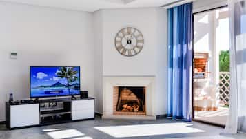 Apartment, 1 Bedroom, Pool Access | Living room | 42-cm flat-screen TV with satellite channels, TV, fireplace
