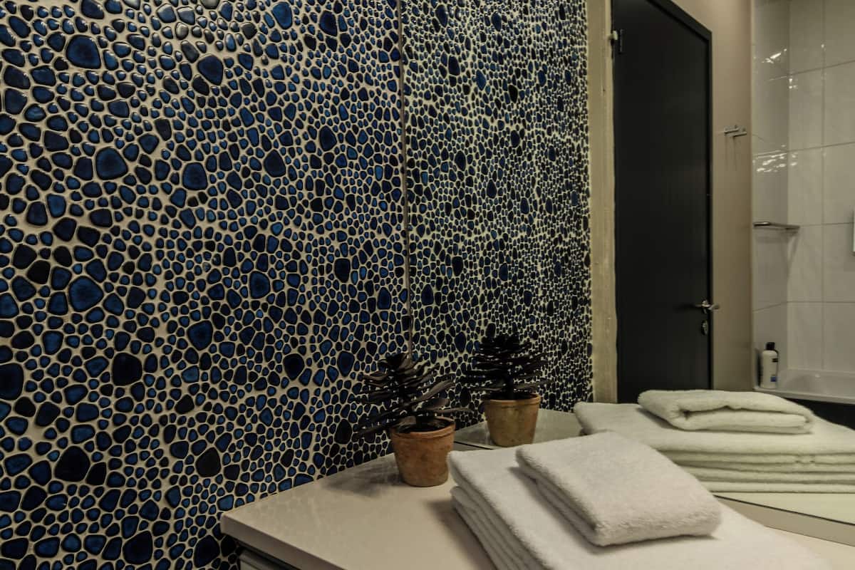 king suite with balcony and mountain view | bathroom | free toiletries, hair dryer, towels