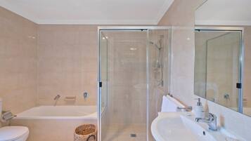 Bathtub, hair dryer, towels, soap
