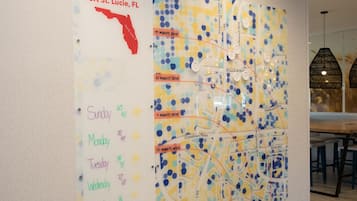 A wall with a map and a schedule.