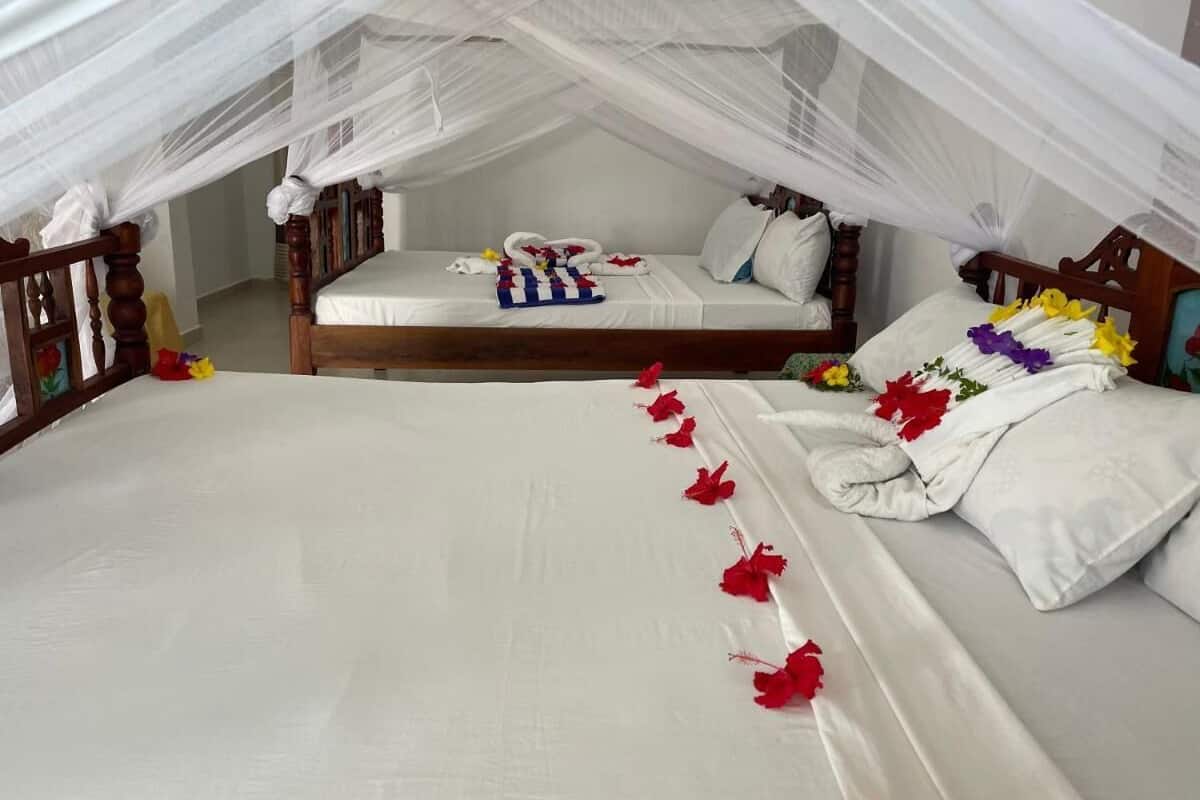 Classic Triple Room, 3 Bedrooms | Minibar, in-room safe, individually decorated, individually furnished