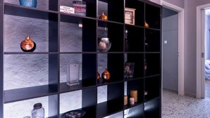 A modern interior with a black shelving unit displaying various decorative items. - S&K Polyxene Suite in Center of Athens (Athens)