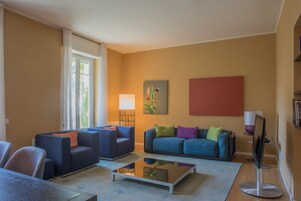 Executive Apartment, 3 Bedrooms, Balcony, Garden View | Living area | Flat-screen TV