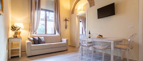 Comfort Apartment | Living area | Flat-screen TV