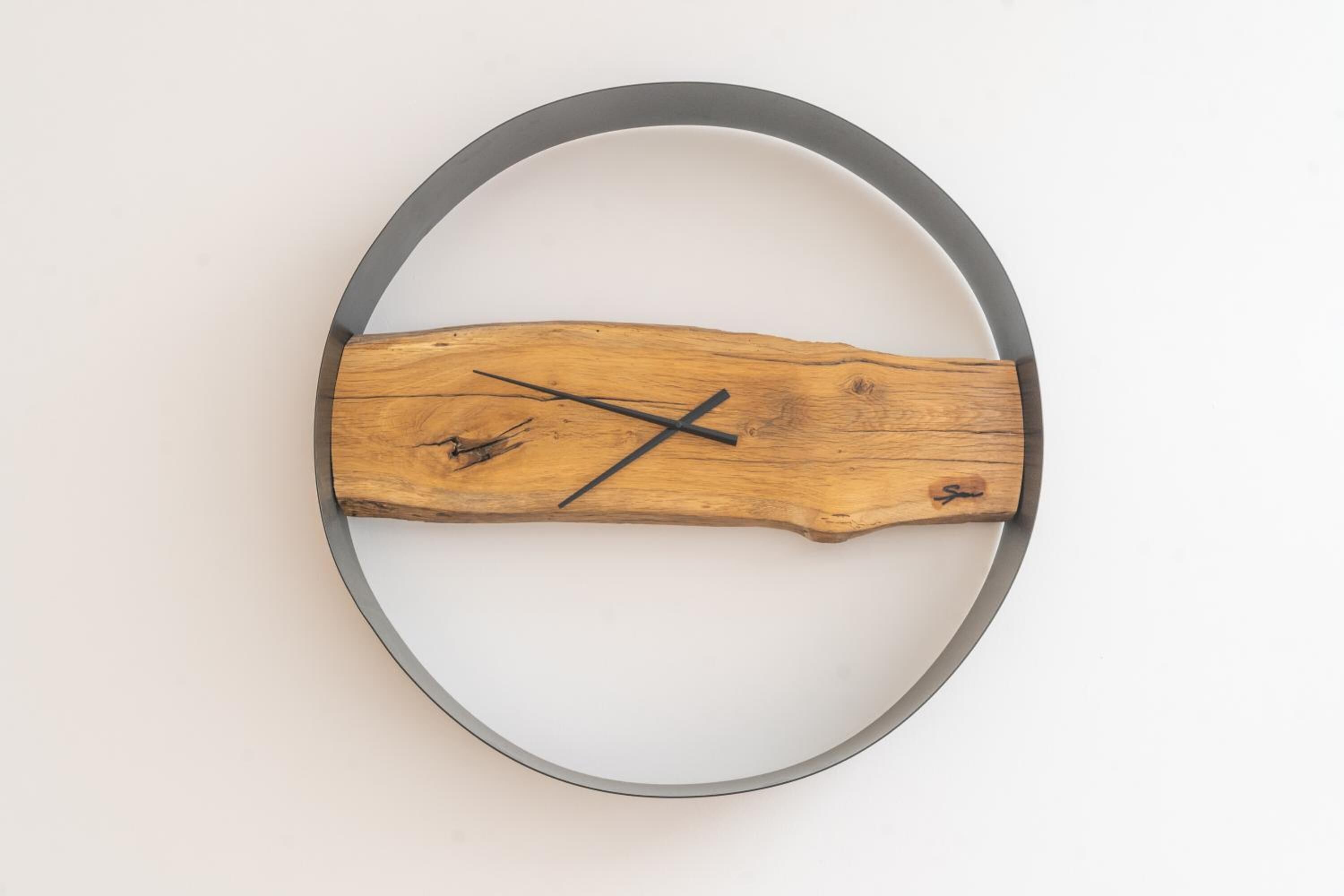 A wooden object with a circular frame, possibly a piece of furniture or decor.