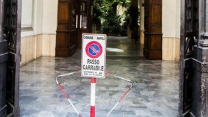 A hotel entrance with a no parking sign, a metal barrier, and a stone floor. - Civico7 (Naples)
