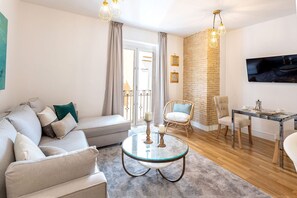 Apartment (1 Bedroom) | Living area | 32-inch TV with cable channels
