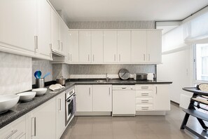 Apartment (4 Bedrooms) | Private kitchen | Full-sized fridge, microwave, oven, espresso maker