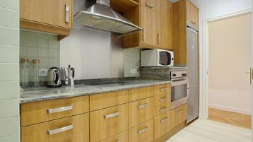 Apartment, 2 Bedrooms | Private kitchen | Full-sized fridge, microwave, oven, dishwasher