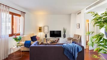 Apartment (4 Bedrooms) | Living room | 32-inch TV with cable channels