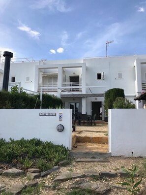 A modern white building with a sign reading "CASA BELLAT 8".