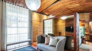 A cozy living room with a sofa, a bench, and a TV. - Droombos (Windhoek)