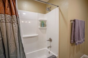 Combined shower/tub, hair dryer, towels, soap