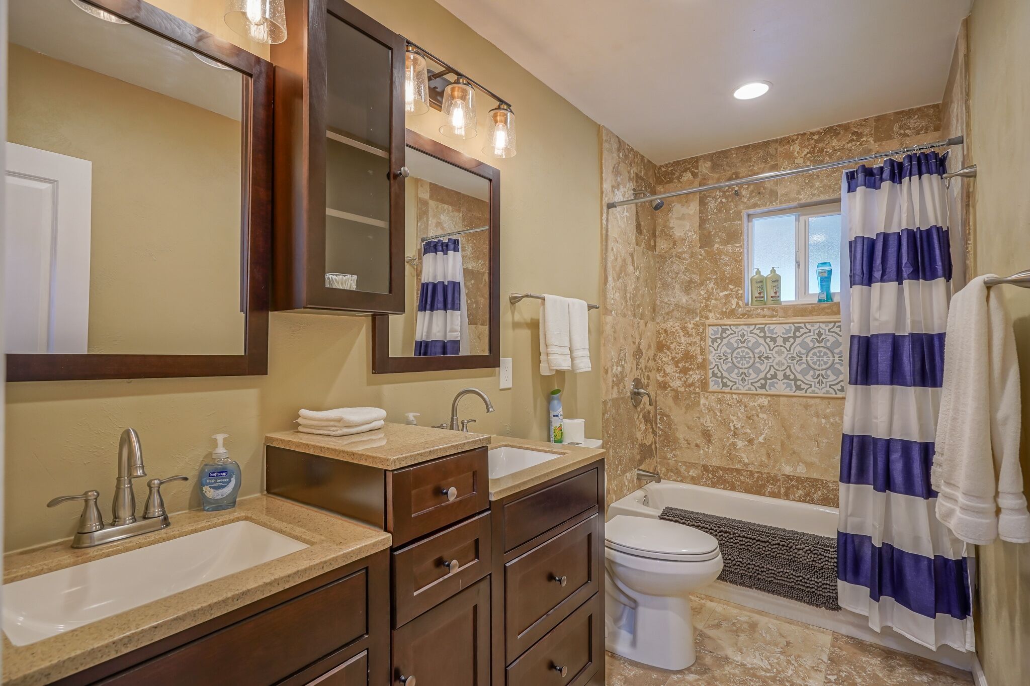 Combined shower/tub, hair dryer, towels, soap