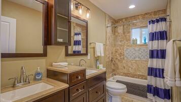 Combined shower/tub, hair dryer, towels, soap