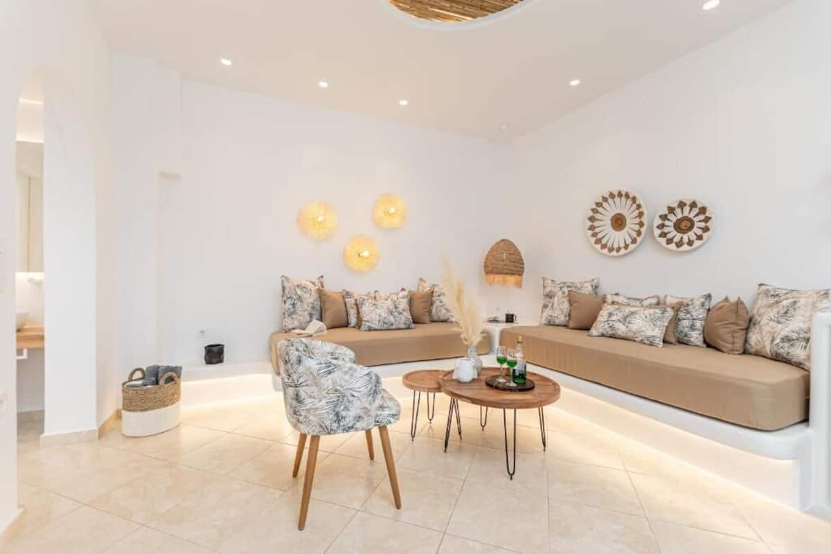 A modern living room with a sofa, a coffee table, and decorative wall art.