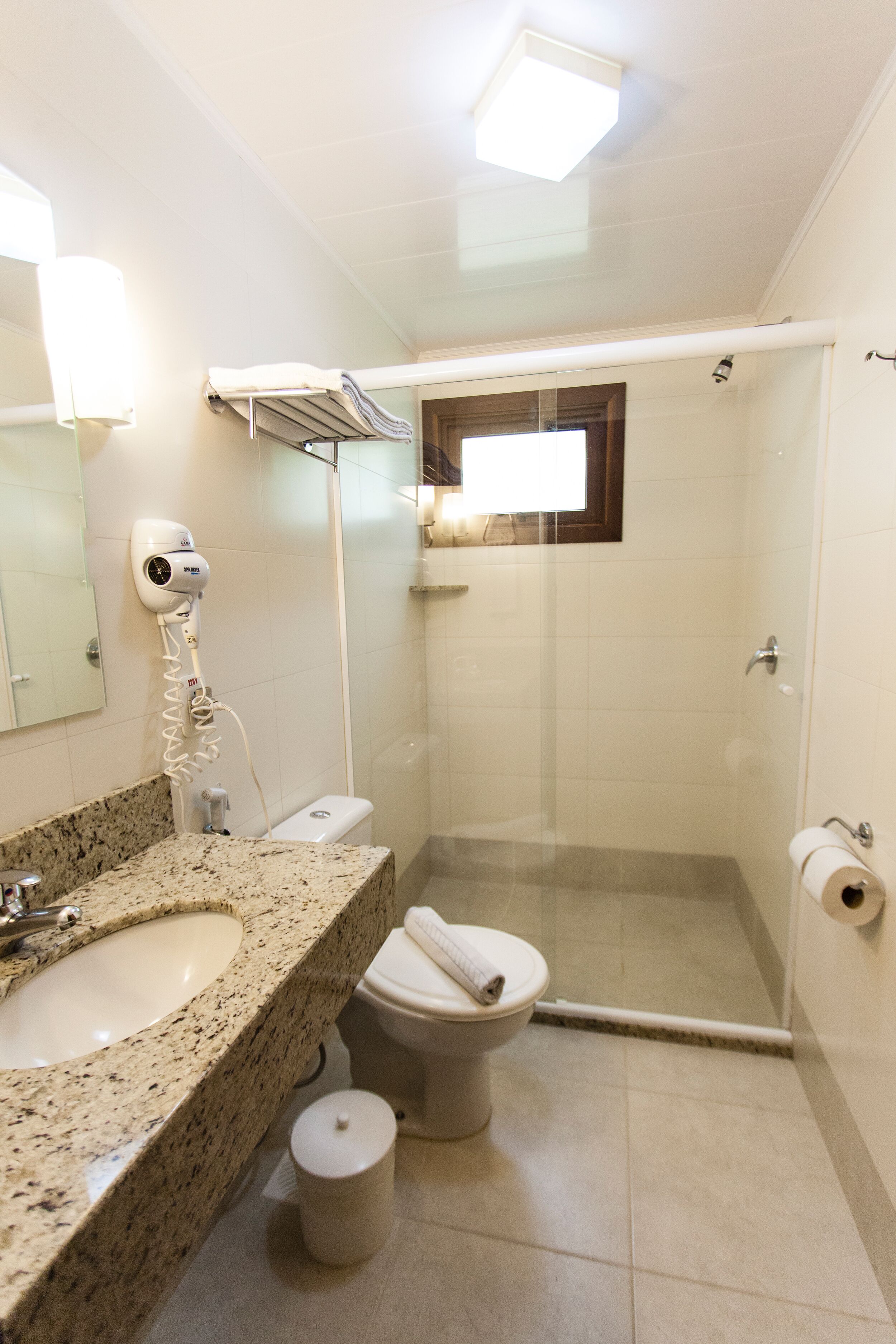 shower, rainfall showerhead, hair dryer, towels