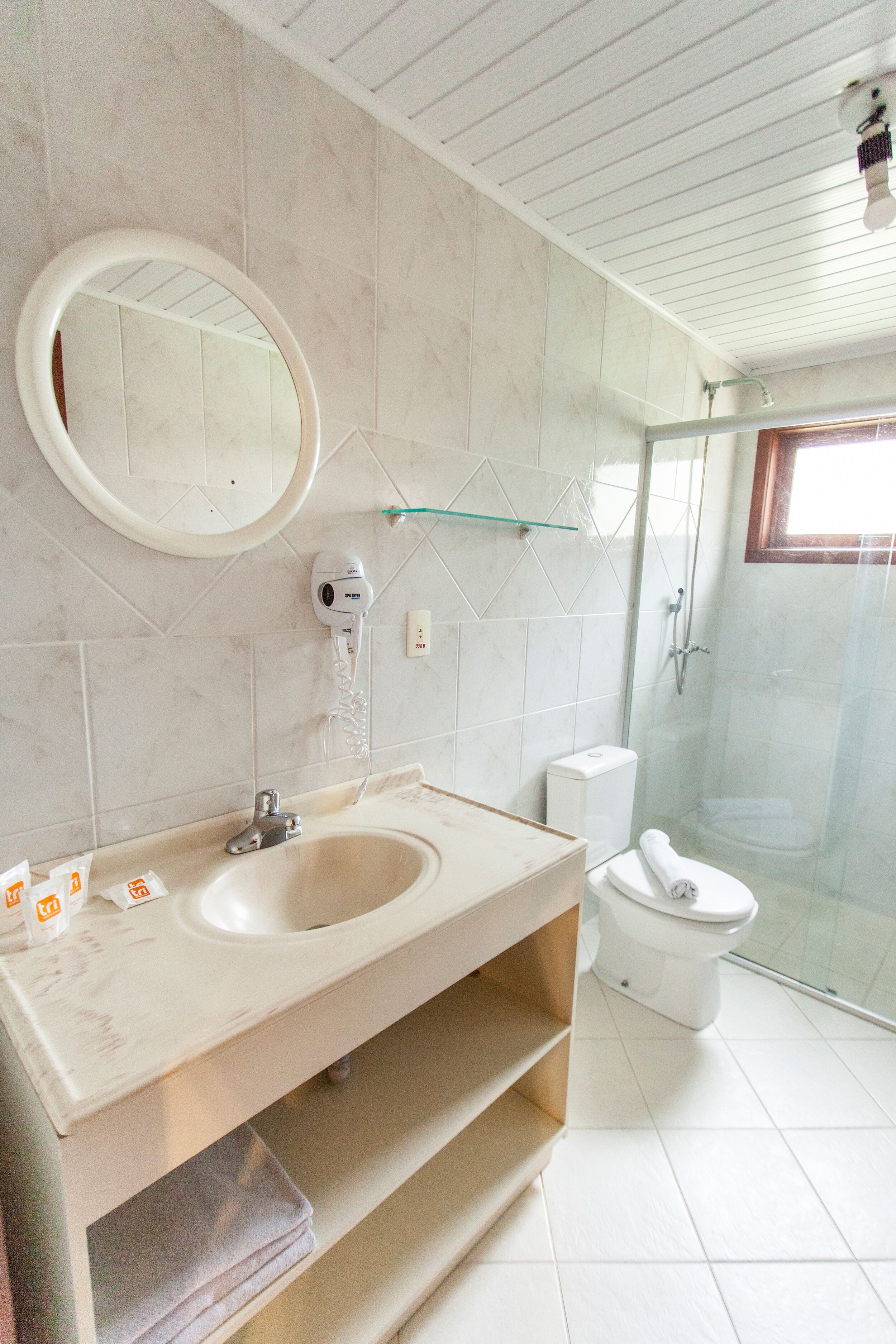 deluxe triple room | bathroom | shower, rainfall showerhead, hair dryer, towels