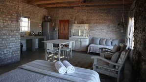 Cottage (Soetdoring) | Living area | Fireplace - Wolvekraal Guest Farm (Prince Albert)