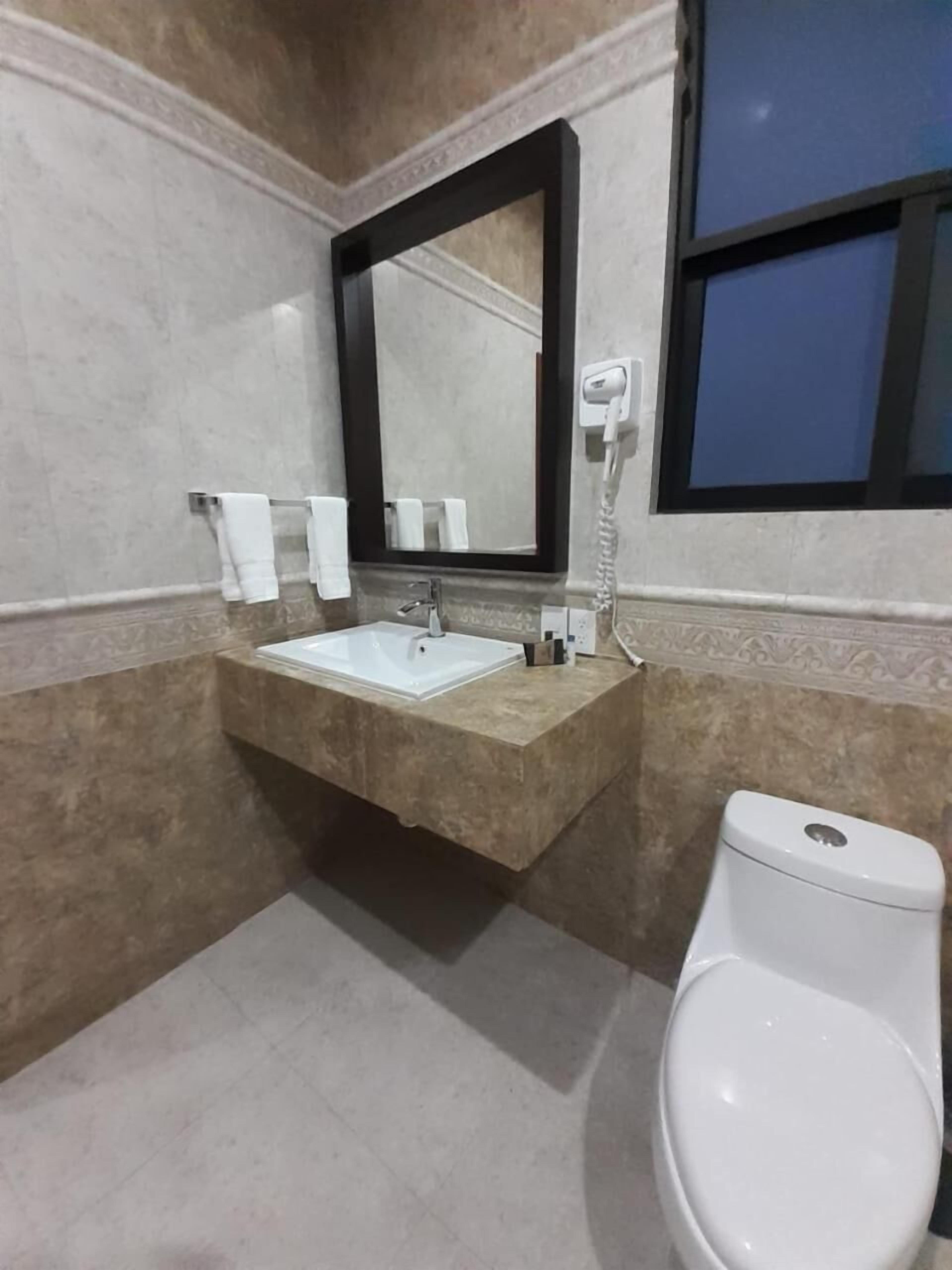 hair dryer, towels, soap, shampoo